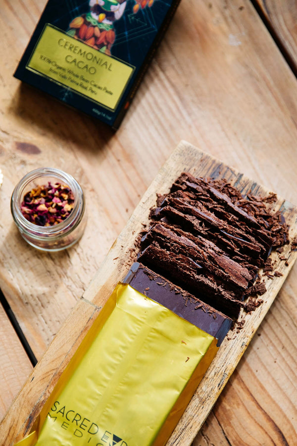 A block of Sacred Earth Medicine Ceremonial Cacao unwrapped and finely chopped, ready to make a sacred hot chocolate.