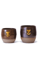 Two hand made Ceremonial Cups, showing both regular (6oz) and large (8oz) sizes. These cups are made from clay that is wild harvested using methods taught by local indigenous people from Mt Jerusalem in the Northern Rivers region of NSW. These cups are made with an enormous amount of love and care. They are definitely the sacred vessel to consume a real ceremonial cacao from!