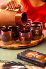 The 1kg bundle is enough to serve around 40 people in cacao ceremony. Here is a woman pouring cups of cacao, preparing to serve her tribe in cacao ceremony.